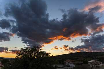 Pink clouds over the village of Mora de Rubielos at sunset, Teruel, Aragon, Spain
