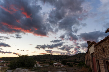 Pink clouds over the village of Mora de Rubielos at sunset, Teruel, Aragon, Spain