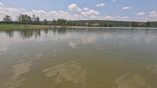 Rowing on the Valbona reservoir in Teruel, Aragon, Spain in summer