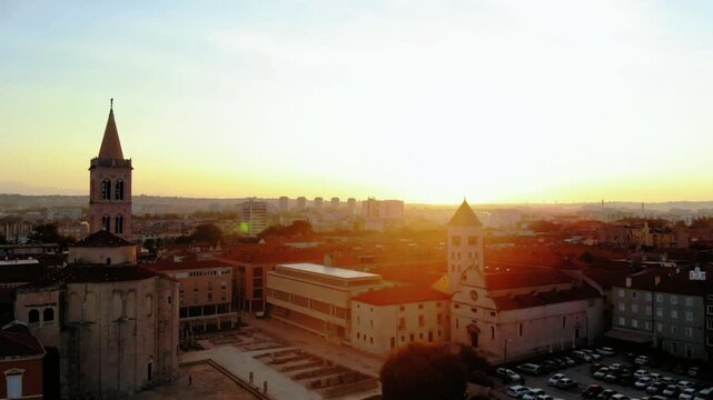 Aerial view of zadar, croatia, at sunset with golden light illuminating the city