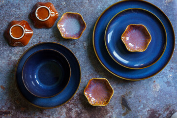 The flat lay composition of ceramic dishes. 