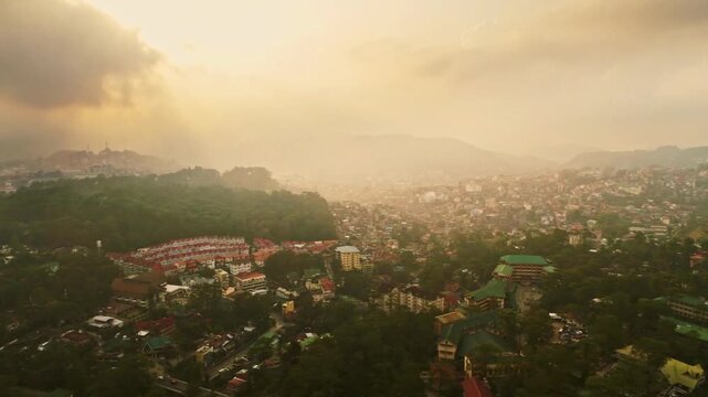 A hazy view of baguio city, philippines, nestled among lush green mountains