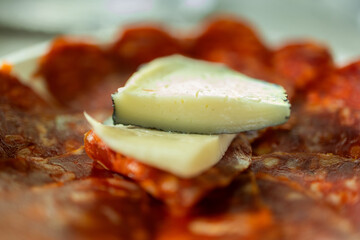 Manchego cheese and chorizo slices tapas appetizer