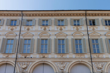 Facade of ornate buildings with an arcade in the center of Turin, Piedmont, Italy, Europe