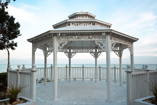 Captivating interior of gazebo showcasing architectural details and view.