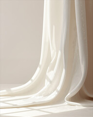 Draped ivory fabric cascading in soft folds