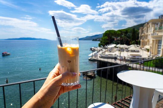 drinking iced caffee on a rooftop bar in opatija croatia - Powered by Adobe