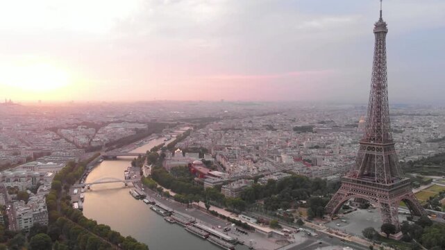 The eiffel tower stands tall over the sprawling cityscape of paris at sunset