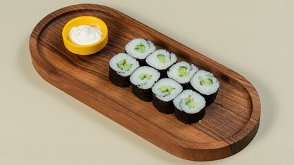 Sushi roll on wooden tray