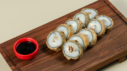 Hot sushi with soy sauce on tray