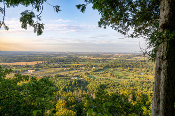 Panoramic view from Mt Nemo in Burlington, Ontario, showcasing lush forests and vast landscapes under a serene sky.