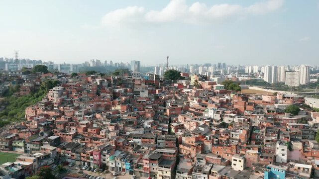 A sprawling favela dominates the urban landscape of so paulo, brazil