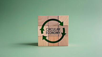 Circular economy concept with wooden blocks and arrows. 