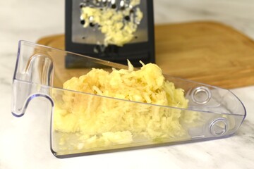 Image of juicy grated apple.