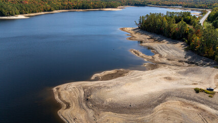 Aerial view of Moore Reservoir in Littleton, NH showing exposed shoreline during drought conditions.