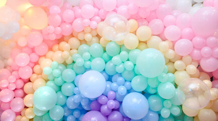 Multicolored birthday and wedding decoration balls as a background. Rainbow colors. Texture round shape.