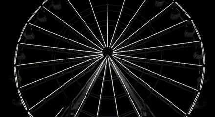 Stunning illuminated Ferris wheel at night creates magical atmosphere for amusement parks