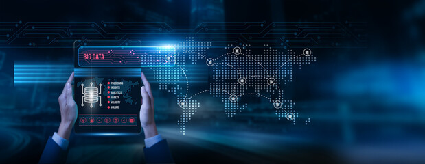 Analyst holding a tablet with big data on the screen: predictive analytics advanced insights decision making digital transformation global information processing real time intelligence, and efficiency