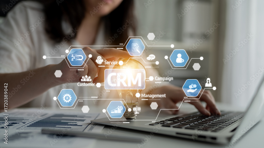 Aufkleber a businesswoman interacting with a crm software interface on her laptop, showcasing modern tools for