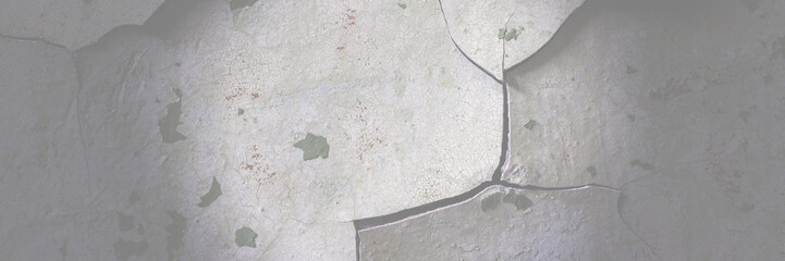 Peeling paint on the wall. Panorama of a concrete wall with old cracked flaking paint. Weathered rough painted surface with patterns of cracks and peeling. Wide panoramic grunge texture for background