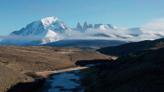 Scenic view of snowcapped mountains and a river in patagonia