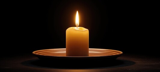 Single Candle Flame in Still Darkness