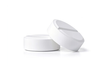 Two large round pills isolated on white background