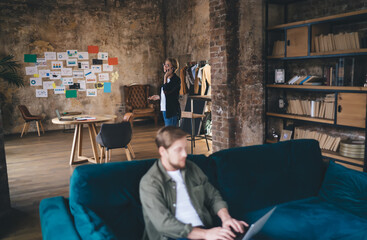 Remote tech worker types on laptop, immersed in digital task flow while maintaining calm focus in...