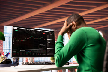 Upset investor dejected after losing money in cryptocurrency investment scam due to rug pull. Sad...