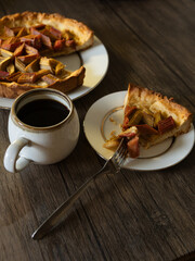 freshly baked Rhubarb pie on a table. piece of a hommade bakery with coffee in a morning