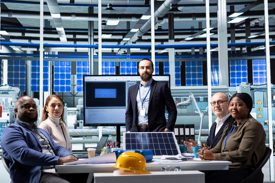 Portrait of industrial factory executives doing meeting to discuss solar panel automation strategies. Production plant leadership team colleagues gathered together to enhance manufacturing processes - Powered by Adobe
