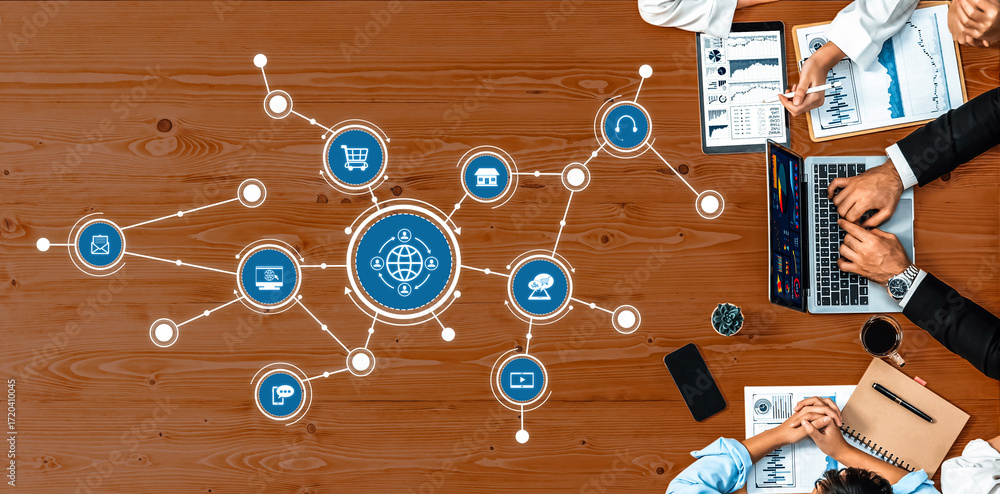 Poster a top view of a modern workspace showcasing professionals analyzing global business strategies with 