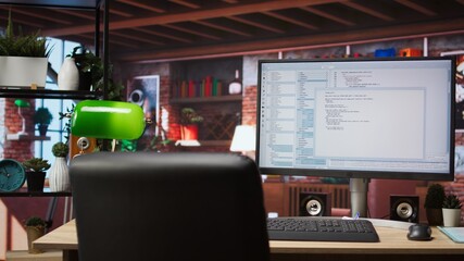 Software development and coding being done on PC, implementing algorithms. Code editor on computer...