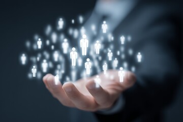 Businessman holding virtual network of people icons in hand