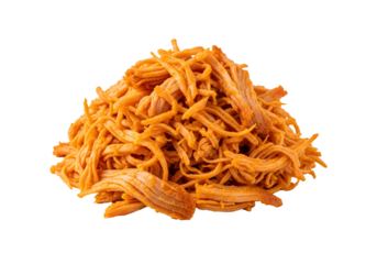 A pile of cooked, shredded chicken, showcasing a vibrant orange hue against a black background.