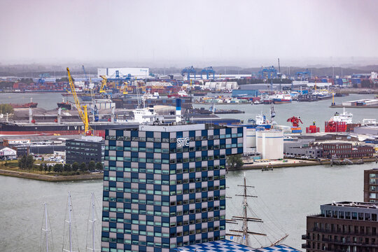 ROTTERDAM, THE NETHERLANDS - SEPTEMBER 13, 2025 - Rotterdam cityscape featuring STC building overlooking industrial harbor in the Netherlands. ROTTERDAM, THE NETHERLANDS - SEPTEMBER 13, 2025 -