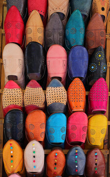 Morocco, Fez, Typical colourful babuchas - hand crafted leather slippers on display in the Medina souk. 