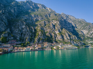 Limone sul Garda old town. Aerial view of panoramic Garda lake and Italian Alps mountains. Lombardy drone landscape of downtown