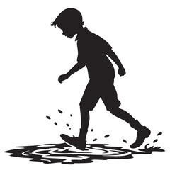 Obraz premium Boy splashing in puddle silhouette