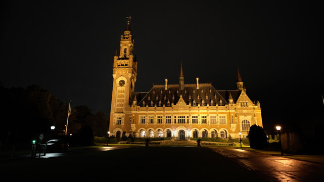 THE HAGUE, NETHERLANDS - SEPTEMBER 14, 2025 - Peace Palace, home to the International Court of Justice, illuminated at night