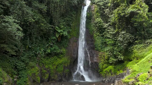 Drone aerial view, Gitgit waterfall, Singaraja, Bali, with green and dense tropical forest