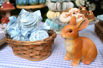 meringue sweets and rabbit figurine, meringue flowers, meringue sweets, party favors, meringue dessert, blue meringue cookies, sweet treats, party treats, sweet treats, party treats

