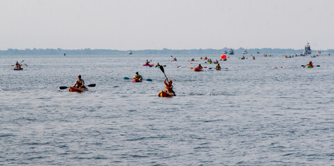 Participants Enjoy Kayaking During a Warm Summer Day on the Bay