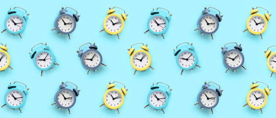 Alarm clocks on blue background