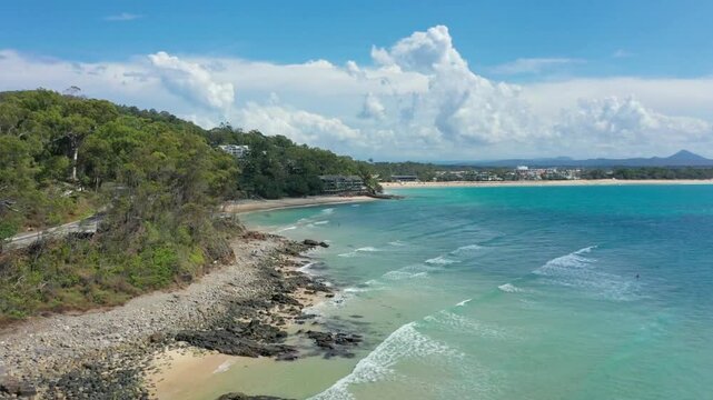 Coastal view of noosa heads, australia, with rocky shoreline and turquoise waters