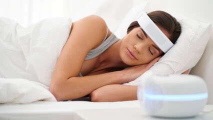 Sleep monitoring headband, woman sleeping with wearable device, smart sleep tracker, vagus nerve stimulation, relaxation technology, brainwave monitoring, health tech for better rest