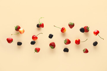 Different berries flying on beige background