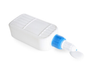 Bottle with spilled glue on white background