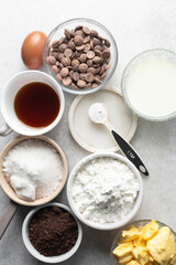 Overhead view of mise en place of ingredients for making chocolate tart, process of make chocolate ganache tart