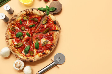 Composition with tasty pizza, ingredients and cutter on beige background